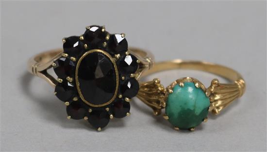 A 9ct gold and garnet cluster ring and a gold and turquoise ring.